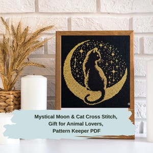May include: A framed cross-stitch featuring a black cat silhouette perched on a gold crescent moon, set against a starry black background. The artwork is displayed in a wooden frame. Text on the image reads: Mystical Moon & Cat Cross Stitch, Gift for Animal Lovers, Pattern Keeper PDF.