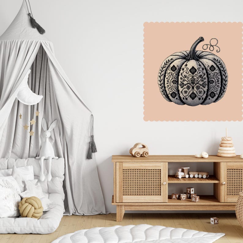 Nursery-style interior with pumpkin print in farmhouse neutral tones.
