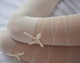 May include: White sheer tights with a delicate criss-cross pattern and two white satin bows.