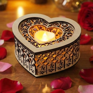 May include: A wooden heart-shaped candle holder with intricate cut-out designs. The candle holder has a heart-shaped opening in the center, and a small, glowing candle is inside. The holder is surrounded by red and pink rose petals.