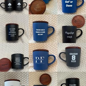 May include: Collection of ceramic mugs with wooden lids and handles. The mugs are in various colors, including black, blue, and white, with printed text and logos. Some mugs have matching wooden coasters.