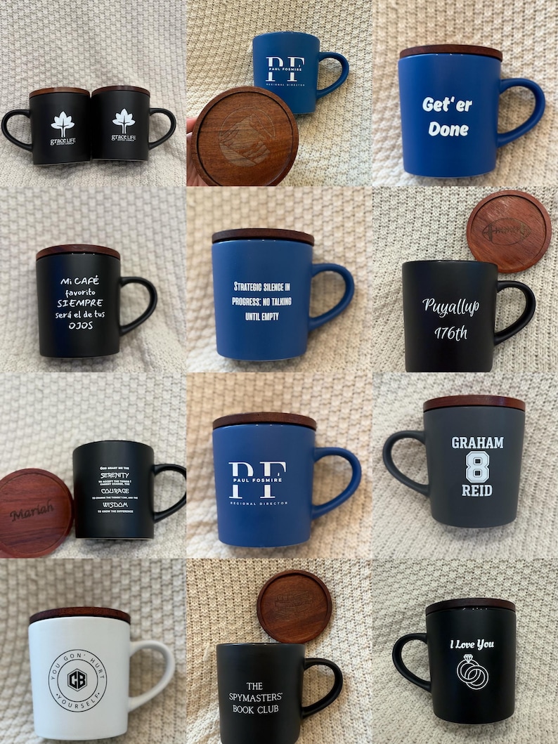 May include: Collection of ceramic mugs with wooden lids and handles. The mugs are in various colors, including black, blue, and white, with printed text and logos. Some mugs have matching wooden coasters.