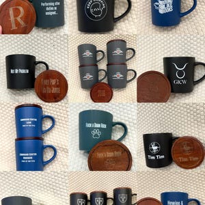 May include: Collection of ceramic mugs in various colors, each with a wooden lid and coaster. Designs include text and graphics like "Keep Chipping", "Bound Like Books", and "Tim Tim".