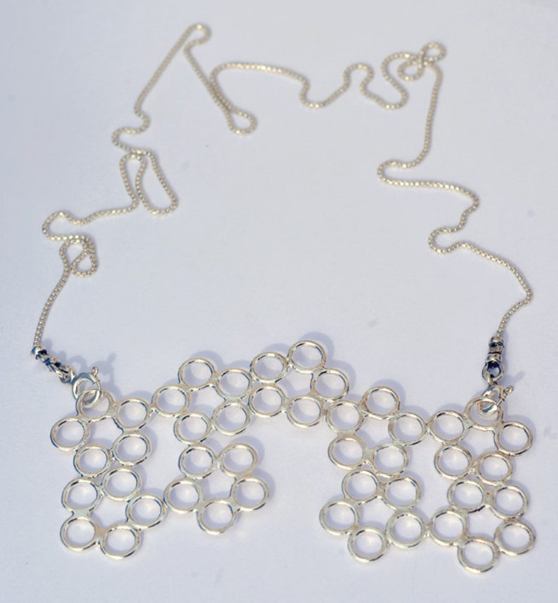 Molecule. Versatile Silver Lace Statement Pendant Necklace. Hand Made Silver Neck Piece. Inspired By Science. Featured on Design-Milk. image 2