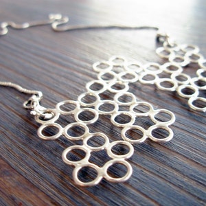 Molecule. Versatile Silver Lace Statement Pendant Necklace. Hand Made Silver Neck Piece. Inspired By Science. Featured on Design-Milk. image 1