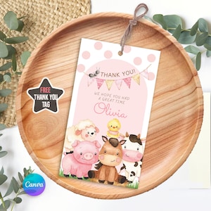 Editable pink farm birthday invitation featuring adorable watercolor barn animals like a pig, cow, chick, lamb, and horse with floral details and a pink barn. Includes a matching thank you tag. Perfect for a girl’s barnyard-themed party. Soft pastel tones and polka dot background add a sweet, charming touch. Instant download, customizable in Canva. Ideal for ages 1–5.