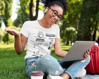 May include: White t-shirt with a black Physics-themed graphic. The graphic includes an apple, books, and equations. The person is wearing glasses and using a laptop while sitting on a concrete ledge with a red backpack and a coffee cup.