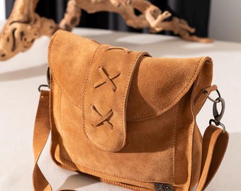 Women's genuine suede leather bag. It is a design product.