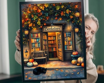 Puede incluir: Una impresión enmarcada de una escena de librería. La obra de arte representa la entrada de una librería acogedora con puertas abiertas, estanterías llenas de libros y un banco. Hay calabazas y un gato negro frente a la tienda. La palabra "Bookstore" está encima de la entrada.