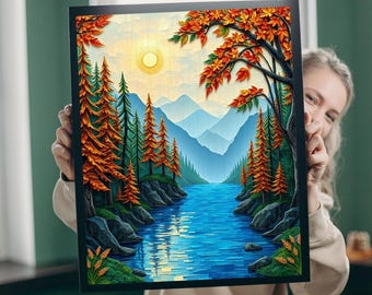 May include: Framed art print depicting a river scene with orange and green trees. The artwork shows a sunny sky, blue mountains, and a vibrant river. The frame is black. The artwork is in a landscape format.
