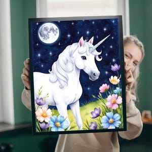 May include: A white unicorn with a silver horn stands in a field of colourful flowers under a full moon and starry night sky.