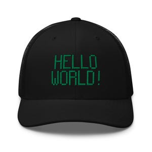 May include: Black trucker hat with a green embroidered design that says "HELLO WORLD!"