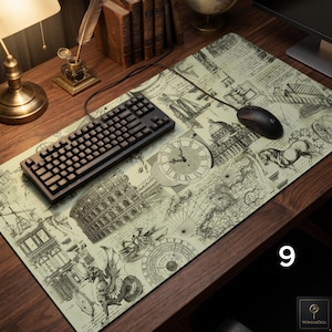 May include: A rectangular desk mat featuring a vintage-style cream background with black line art illustrations of historical landmarks, a clock face, a horse, and navigational maps. A black mechanical keyboard and a black computer mouse sit on top.