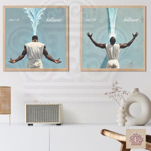 May include: Two framed prints with a blue background and a person with their arms raised. The person is being doused with water. The text "believer." is printed on each print. The text "John 7:38" is printed on the top left corner of each print.
