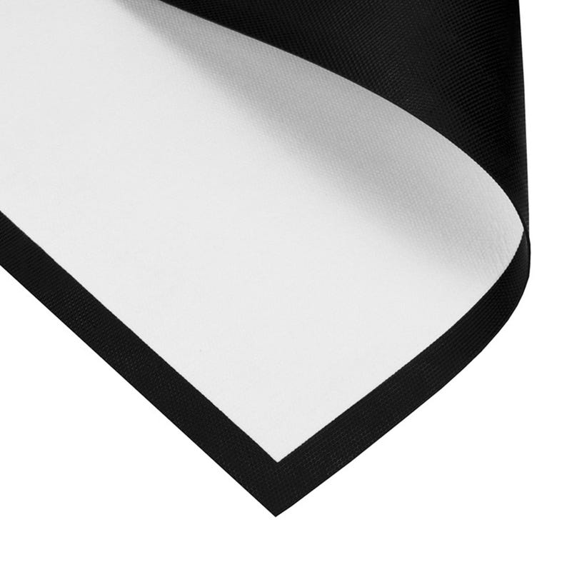 May include: A black and white rectangular fabric with a black border. The corner of the fabric is folded over, revealing the white interior. The black border has a textured appearance.
