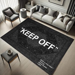 May include: Black and white rug with a vintage pattern and the text "KEEP OFF" in white. The rug has a small text label in the bottom right corner that reads "IKEA® c/o Virgil Abloh™ "Flooring" Almhult, Sweden c.2019"
