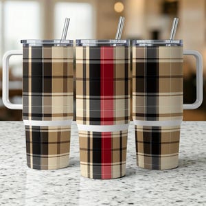 May include: Three stainless steel travel mugs with handles and straws. The mugs feature a plaid pattern in black, brown, tan, red, and white. The mugs have a white band near the base and a silver rim.
