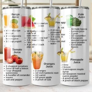 May include: A white stainless steel tumbler featuring recipes for various juices, including mango, watermelon, pineapple, kale, tomato, and orange juice. Each recipe lists ingredients and measurements.