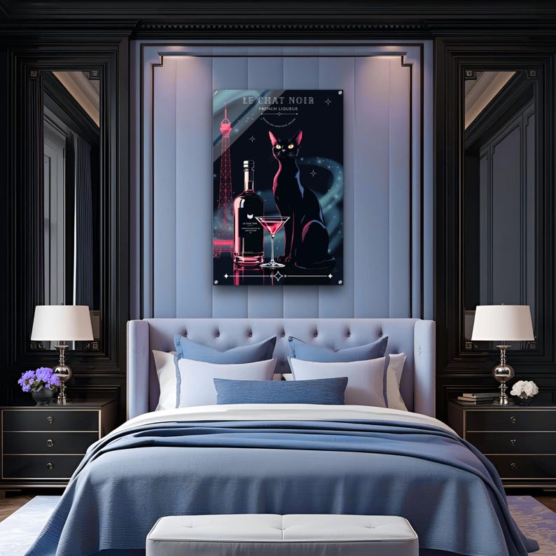 May include: A framed art print featuring a black cat, a bottle, and a cocktail glass. The artwork has a dark color scheme with the text "LE CHAT NOIR FRENCH LIQUEUR". The Eiffel Tower is also depicted in the background.
