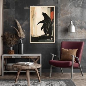 May include: An abstract art print featuring a black bear standing on its hind legs, set against a backdrop of neutral tones and red accents. The artwork is framed and displayed on a dark gray wall, adding a touch of nature-inspired decor.