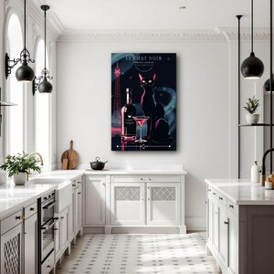 May include: A framed art print featuring a black cat, a bottle, and a cocktail glass. The artwork has a dark background with the text "LE CHAT NOIR FRENCH LIQUEUR". The Eiffel Tower is also visible in the background.