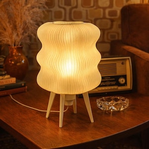 Translucent wavy designer lamp | Elegant Wave table lamp | Soft and warm light | Customizable base | E27 socket