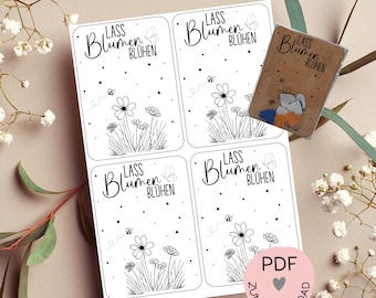 May include: Four printable cards with a black and white illustration of flowers and a bee. The text on the cards reads "Lass Blumen Blühen" which translates to "Let the flowers bloom".