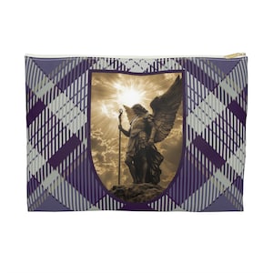 May include: A purple and gray plaid zippered pouch with a shield-shaped design featuring a golden angel statue with wings and a staff. The angel is standing on a rock with a bright light shining behind it.