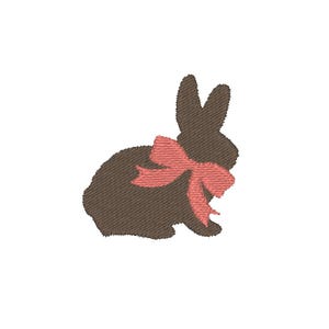 May include: A brown silhouette of a rabbit with a pink bow.