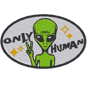 May include: A green alien with large eyes and a peace sign makes a statement with the text "Only Human" on a gray oval patch.