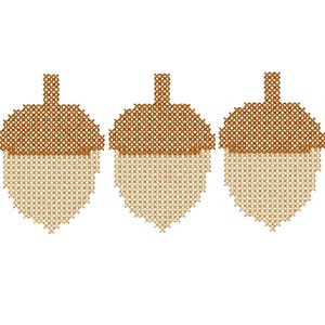 May include: Three identical acorn shapes arranged in a horizontal row, each created with a cross-stitch pattern. The top cap of each acorn is a dark brown colour, while the bottom nut portion is a lighter beige colour, forming a repeating design.
