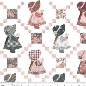 May include: A repeating pattern featuring stylized figures of girls in bonnets and dresses, holding wheat. The design incorporates floral squares and a pink dotted grid on a white background. The color palette includes pink, gray, and brown tones.
