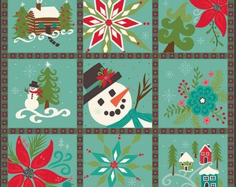 Könnte beinhalten: Ein blaugrünes Patchwork-Quilt-Design mit Winterthema. Die Decke zeigt eine Hütte, einen Schneemann, eine Schneeflocke, einen Weihnachtsstern, einen Weihnachtsbaum und ein Dorf.