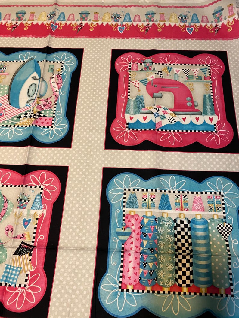 May include: A fabric panel featuring four distinct sewing-themed illustrations. Each illustration is framed in a black and white border with a pink or blue background. The illustrations include a sewing machine, an iron, spools of thread, and fabric scraps.