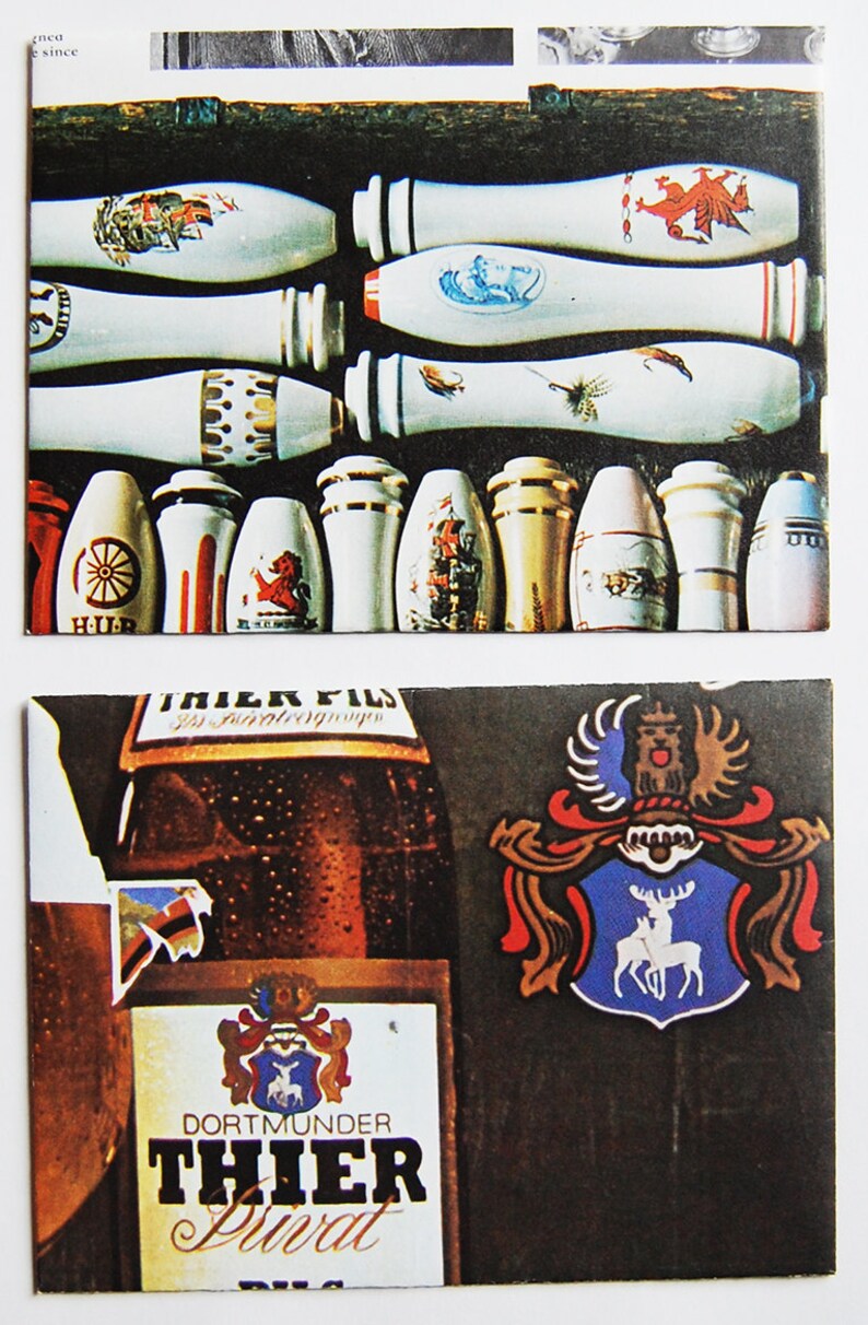 May include: A brown glass bottle of Dortmunder Thier Privat Pils beer with a white label and a red, white, and blue crest. The bottle is in front of a blue and white crest with a red and white deer.