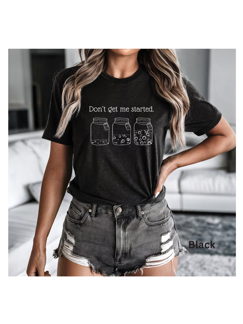 Don't Get Me Started text above sourdough starter jars on black Bella Canvas Tshirt