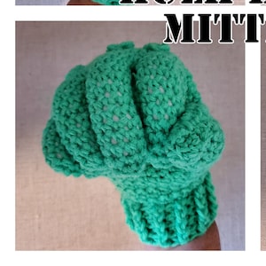 May include: Green crocheted mittens shaped like Hulk's hands. "Hulk Hands Mittens" is written in black text on a white background.