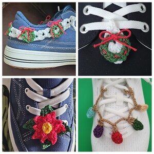 May include: A collection of handmade crochet shoe decorations. The decorations include a Christmas wreath, a poinsettia, a string of lights, and a garland of wreaths and bows. The decorations are in various colors, including red, green, and white.