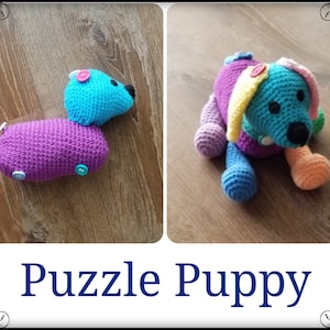 May include: A colorful crocheted puzzle puppy toy with buttons for eyes and a purple body. The toy is made of different colored yarn and is a fun and educational toy for children.