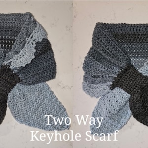 May include: Two-way keyhole scarf in gray and blue with a crocheted design. The scarf can be worn in two different ways, with the keyhole opening at the front or the back.