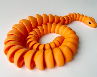 Juguete de serpiente naranja