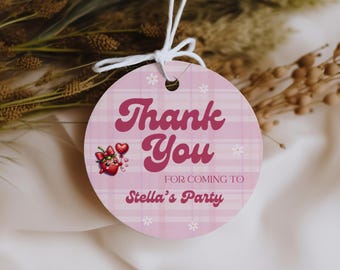 May include: Pink and white gingham patterned circle thank you tag with a cartoon strawberry and the text "Thank You for coming to Stella's Party".