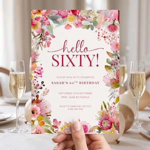 May include: A rectangular birthday invitation card featuring a cream background with a vibrant watercolor floral border in shades of pink, red, and yellow. The text reads: hello SIXTY! PLEASE JOIN US TO CELEBRATE SARAH'S 60TH BIRTHDAY SATURDAY 6TH OCTOBER 3PM | BAR BOTANICA RSVP TO TANYA BY 1ST OCT 0456 382 736.