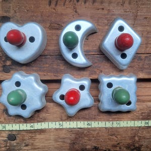 Six Vintage Aluminum Cookie Cutters, Red and Green wood knobs