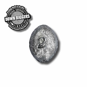 May include: A silver-colored, round fishing weight with the number "2" embossed on it.