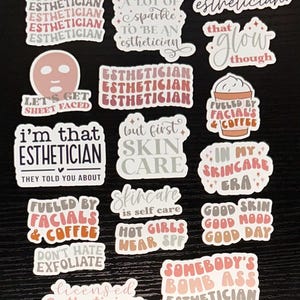 May include: A collection of stickers with text related to estheticians and skincare. The stickers feature phrases like "Esthetician," "Skin Care," and "Fueled by Facials & Coffee." Colors include white, pink, and brown.