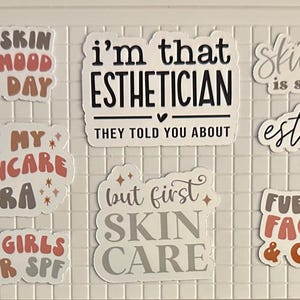 May include: A collection of stickers with skincare and esthetician-themed phrases. The stickers feature phrases like "Don't Hate Exfoliate," "Good Skin Good Mood Good Day," and "I'm That Esthetician." Colors include white, black, brown, and peach.