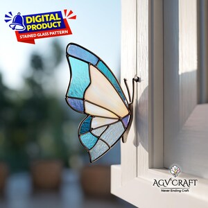 May include: A stained glass butterfly with blue, white, and light blue panels is mounted on a white window frame. The butterfly has a metal frame and is labeled as a digital product. The text "DIGITAL PRODUCT STAINED GLASS PATTERN" is visible.
