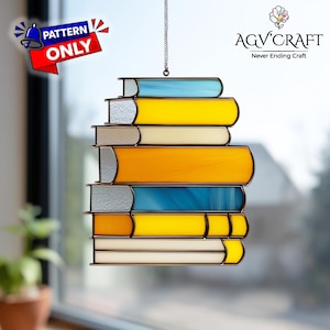 May include: A stained glass book stack suncatcher with a variety of colors including yellow, blue, orange, and white. The suncatcher is suspended by a chain and features the text "PATTERN ONLY". The AGV Craft logo is visible in the upper right corner.