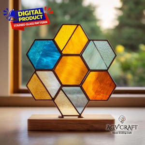 May include: A stained glass pattern in a honeycomb design, featuring various colors including blue, yellow, and orange. The artwork is mounted on a wooden base. The image includes the text "DIGITAL PRODUCT STAINED GLASS PATTERN".